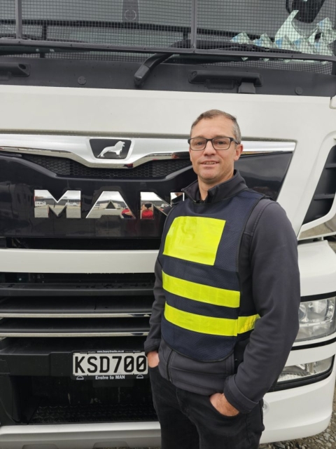 TruckSafe Programme Manager John Samson standing in front of a big Mack truck
