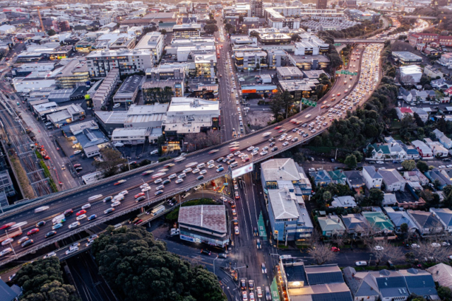 Aerial view of a busy city motorway flyover full of traffic