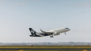 Air NZ plane taking off on a fine day